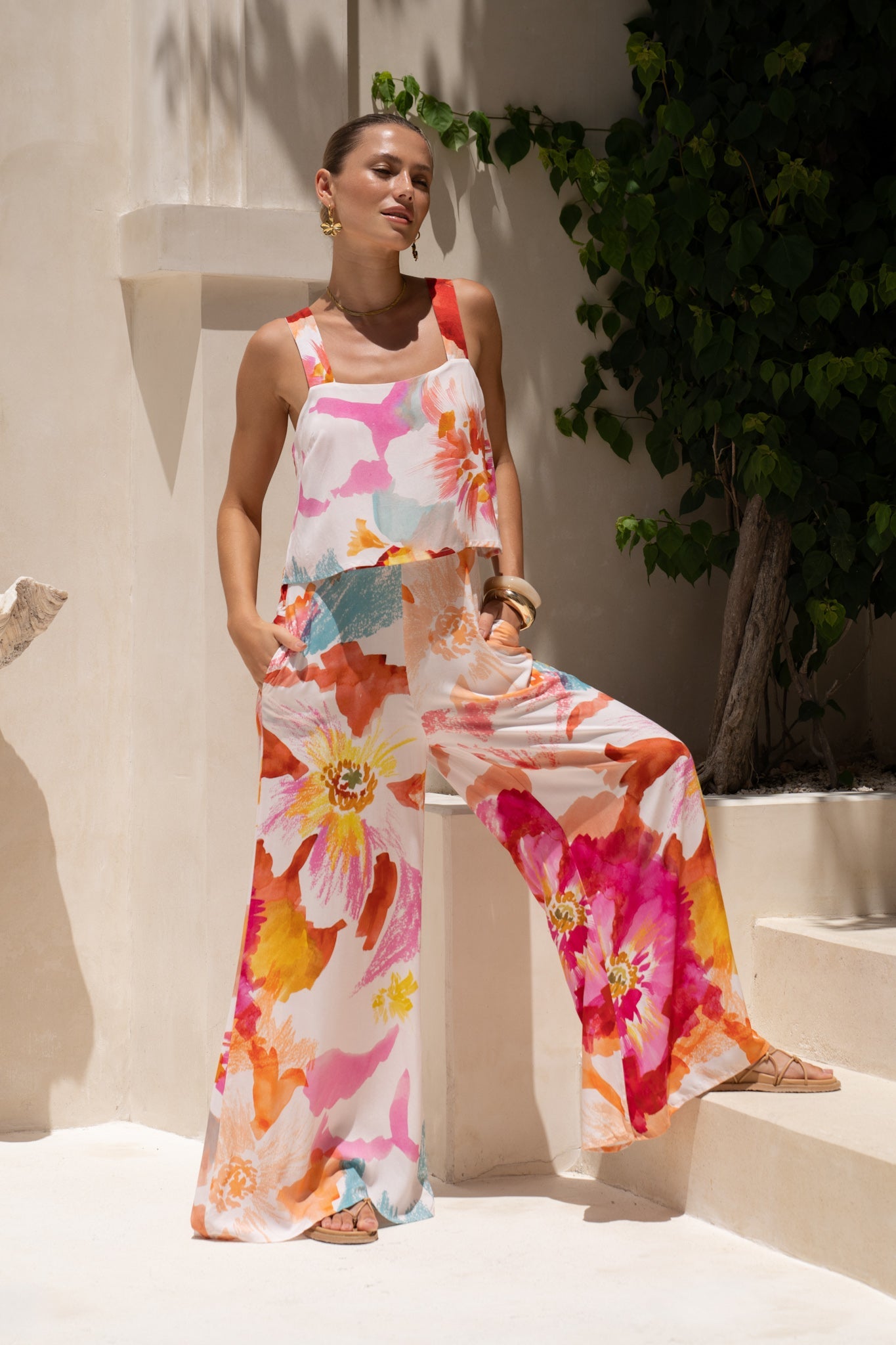 Image of a model wearing Outerwear. Productname: HEYCHIC Genevieve Pink Floral Jumpsuit in Pink colour by brand - HEYCHIC