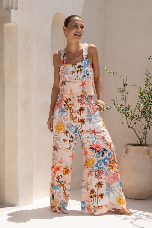 Image of a model wearing Outerwear. Productname: HEYCHIC Lumeia Pink Tropical Jumpsuit in Pink colour by brand - HEYCHIC