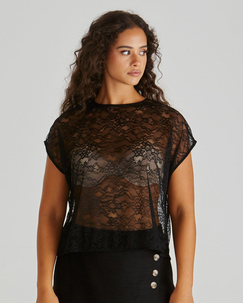 Image of a model wearing Tops. Product name - Liam Lace Button Back Tank Black in Black colour by brand - Sass Clothing