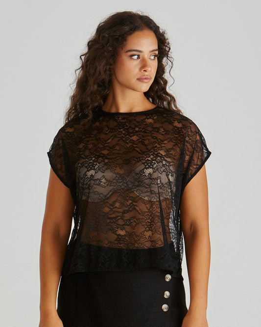 Image of a model wearing Tops. Product name - Liam Lace Button Back Tank Black in Black colour by brand - Sass Clothing