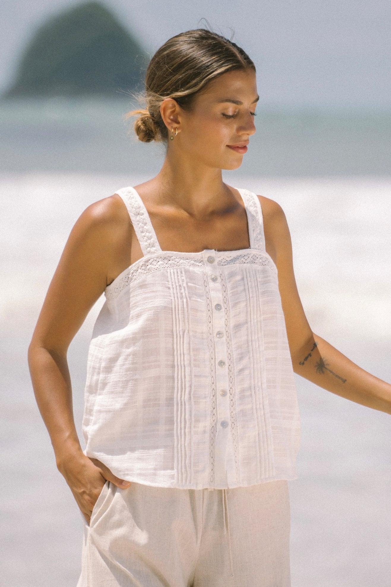 Image of a model wearing Tops. Productname: Heychic Ari White Cami Top in White colour by brand - Heychic