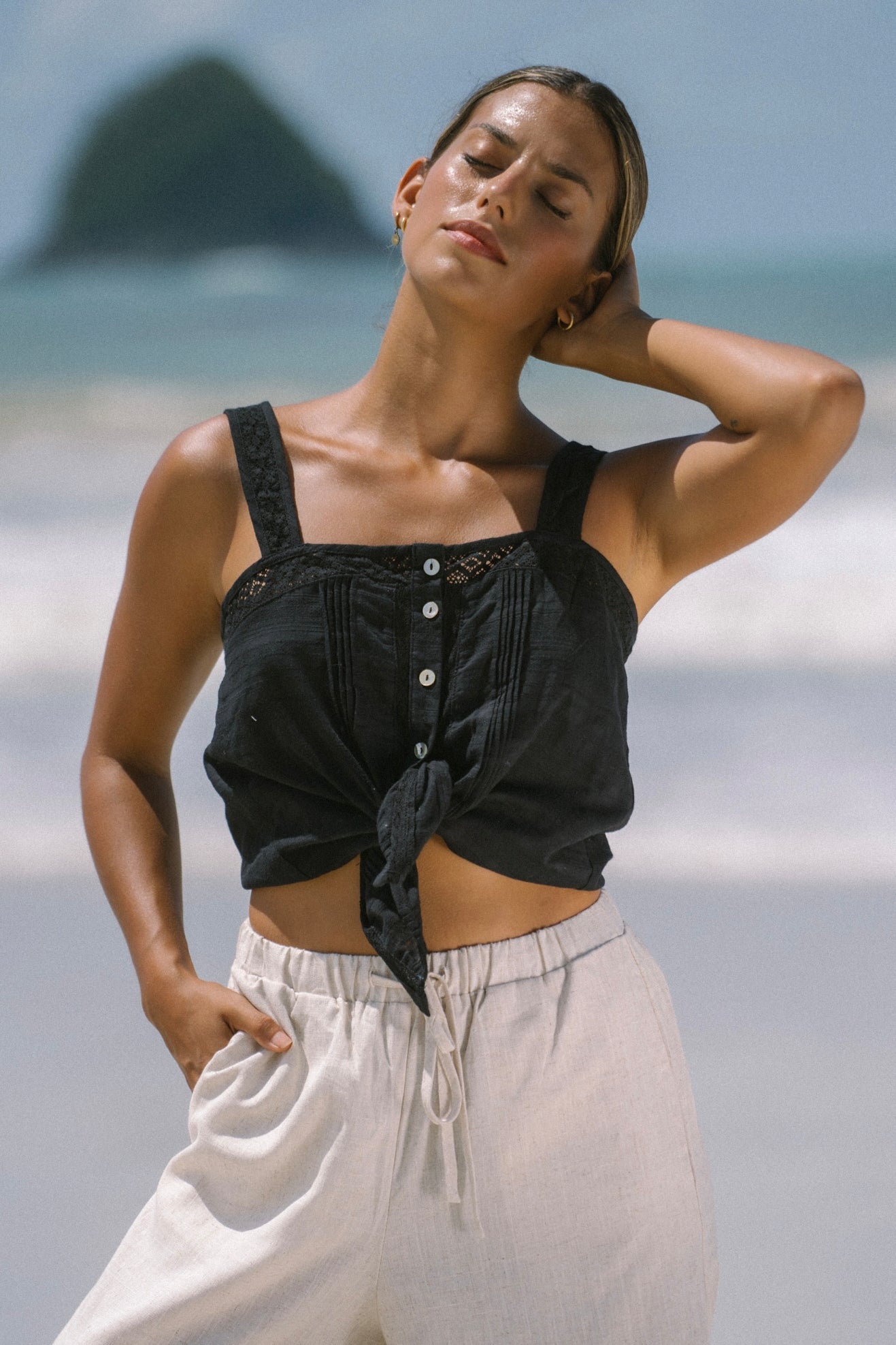 Image of a model wearing Tops. Productname: Heychic Ari Black Cami Top in Black colour by brand - Heychic