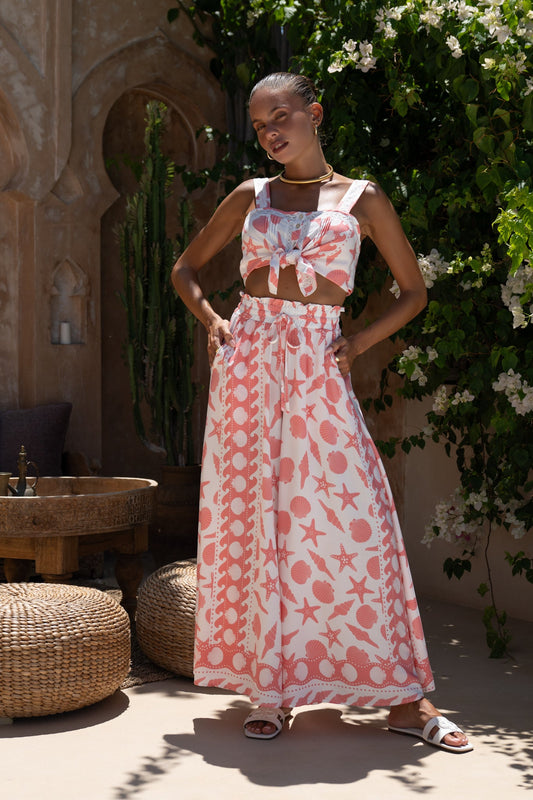 Image of a model wearing Pants. Productname: Heychic Naia Abstract Wide Leg Cropped Pants in Red colour by brand - Heychic