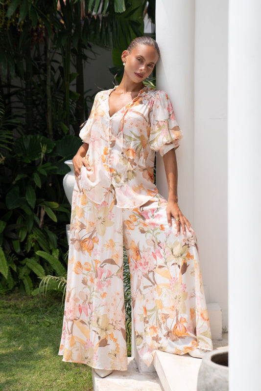 Image of a model wearing Pants. Productname: Heychic Lillian Floral Wide Leg Pants in Orange colour by brand - Heychic