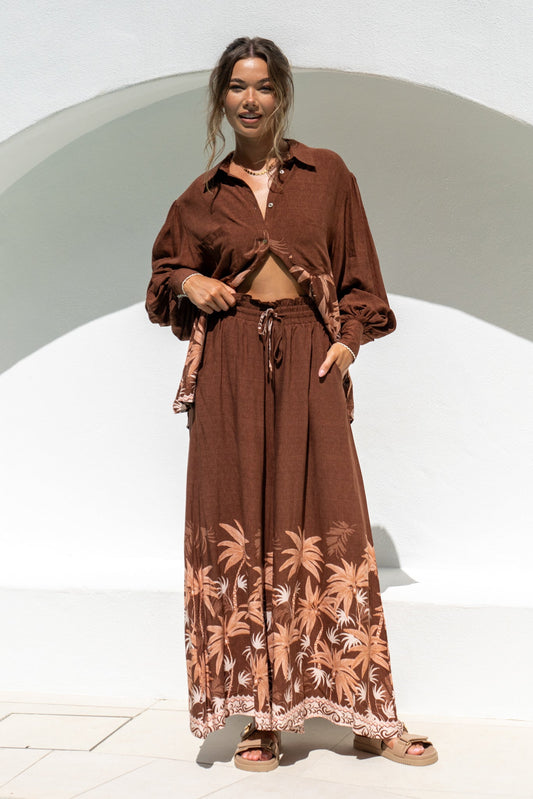 Image of a model wearing Pants. Productname: Heychic Eriselle Tropical Wide Leg Pants in Brown colour by brand - Heychic