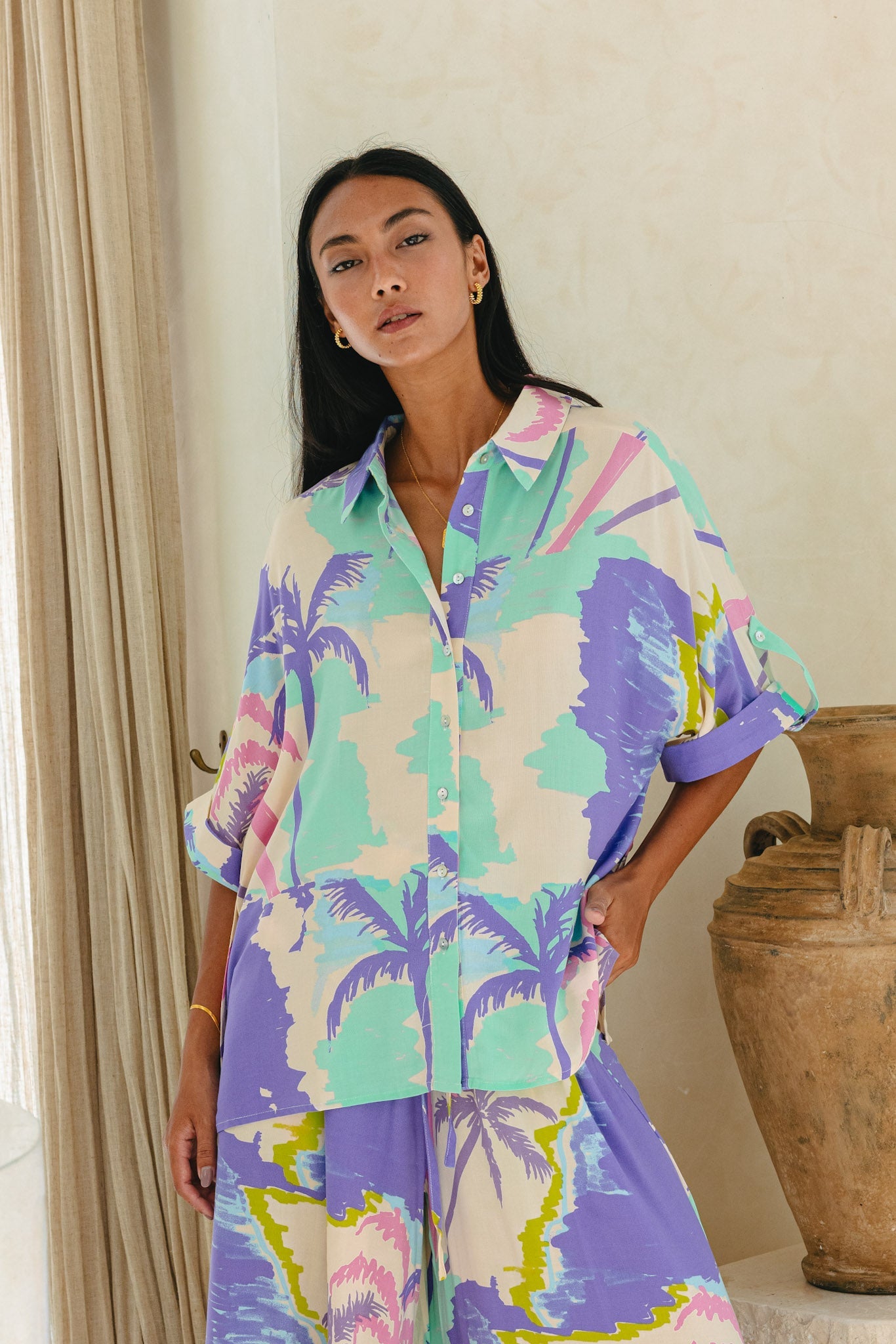 Image of a model wearing Tops. Productname: Heychic Paradisio Tropical Oversized Shirt in Purple colour by brand - Heychic