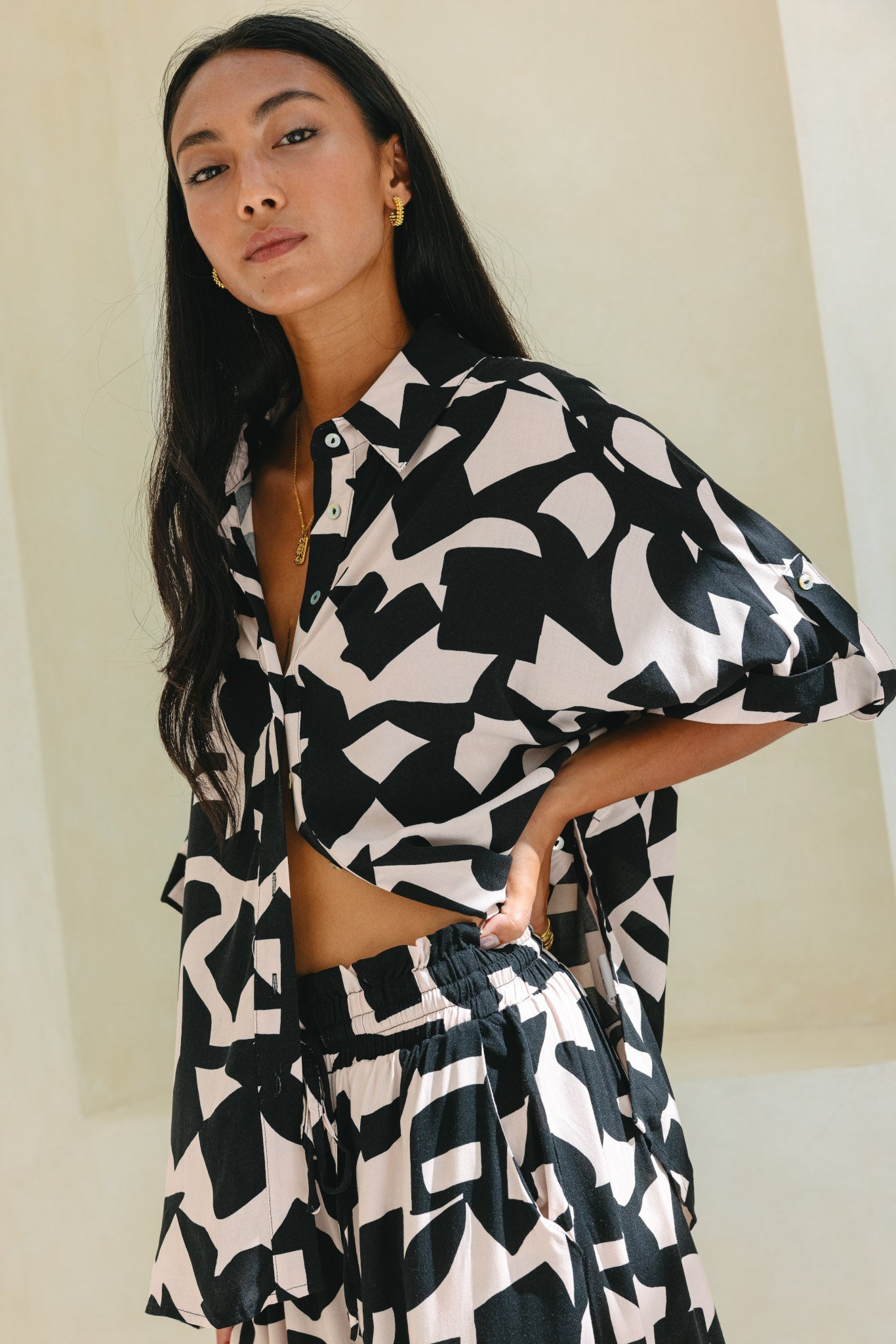 Image of a model wearing Tops. Productname: Heychic Nyx Black Abstract Geo Oversized Shirt in Black colour by brand - Heychic