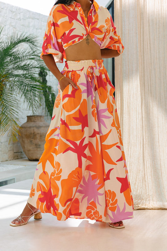Image of a model wearing Pants. Productname: Heychic Calinda Abstract Wide Leg Cropped Pants in Orange colour by brand - Heychic