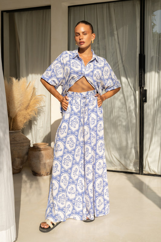 Image of a model wearing Pants. Productname: Heychic Delilah Floral Wide Leg Pants in Blue colour by brand - Heychic