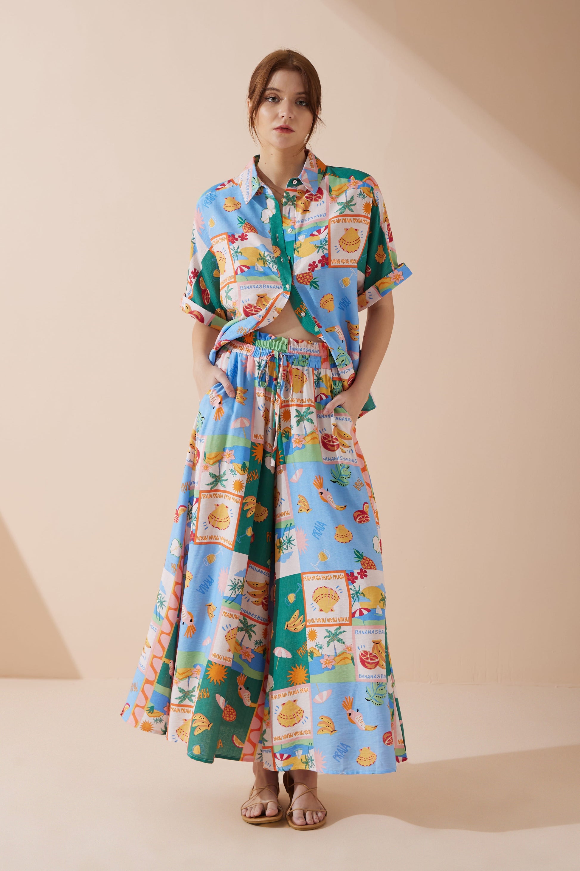 Image of a model wearing Pants. Product name - Praia Multicolour Tropical Wide Leg Cropped Pants in Multi colour by brand - Heychic