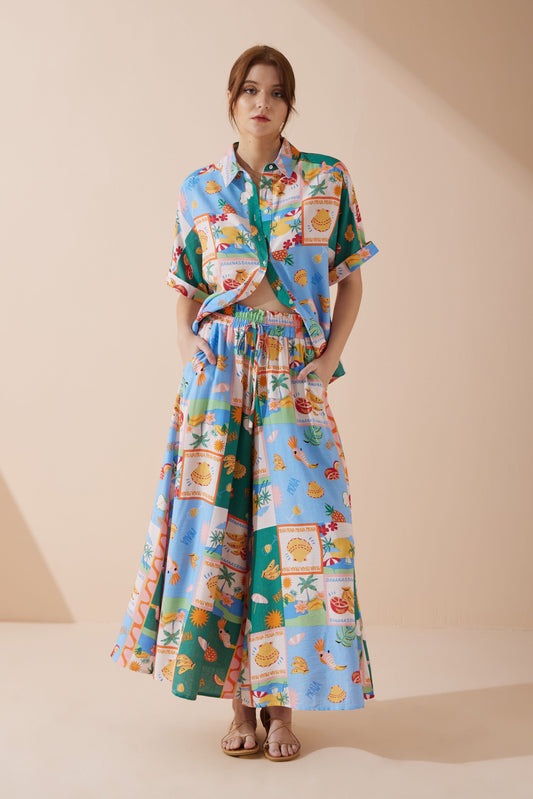 Image of a model wearing Pants. Product name - Praia Multicolour Tropical Wide Leg Cropped Pants in Multi colour by brand - Heychic