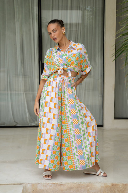 Image of a model wearing Pants. Productname: Annelie Multicolour Abstract Tile Wide Leg Cropped Pants in Multi colour by brand - Heychic