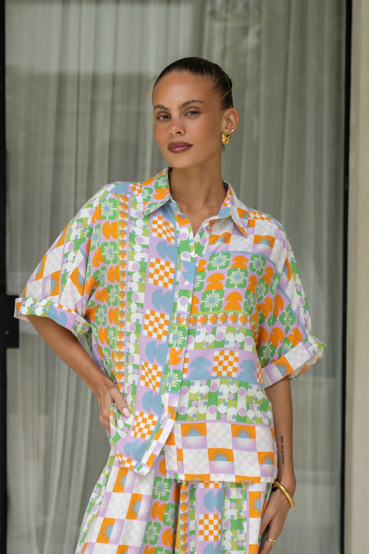 Image of a model wearing Tops. Product name - Annelie Multicolour Abstract Tile Shirt in Multi colour by brand - Heychic