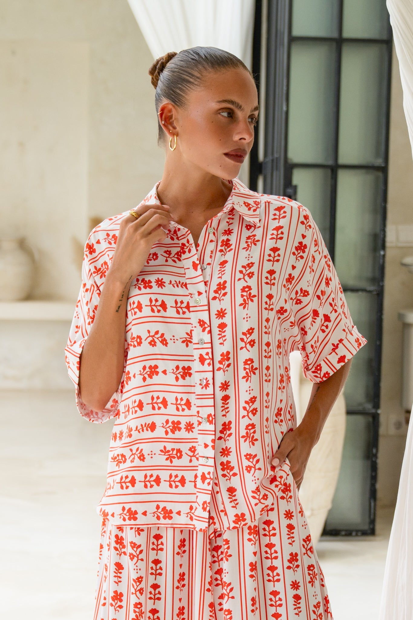 Image of a model wearing Tops. Product name - Rosaia Red Boho Floral Shirt in Floral colour by brand - Heychic