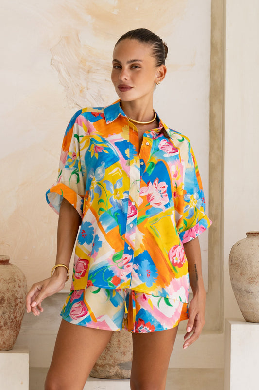 Image of a model wearing Tops. Product name - Jardin Multicolour Floral Shirt in Floral colour by brand - Heychic