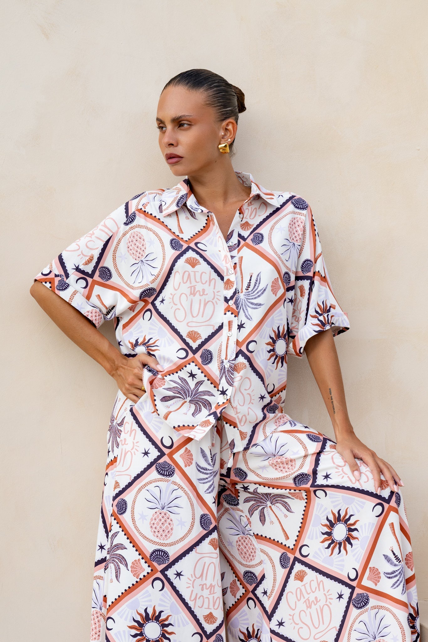Image of a model wearing Tops. Productname: Heychic Kalani Abstract Tile Shirt in Brown colour by brand - Heychic