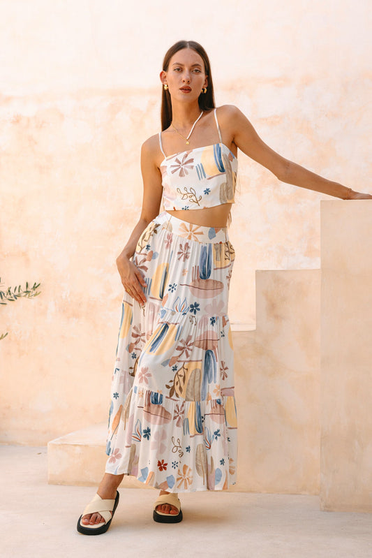 Image of a model wearing Pants. Productname: Heychic Nyra Abstract Tiered Maxi Skirt in White colour by brand - Heychic