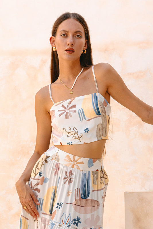 Image of a model wearing Tops. Productname: Heychic Nyra Abstract Crop Top in White colour by brand - Heychic