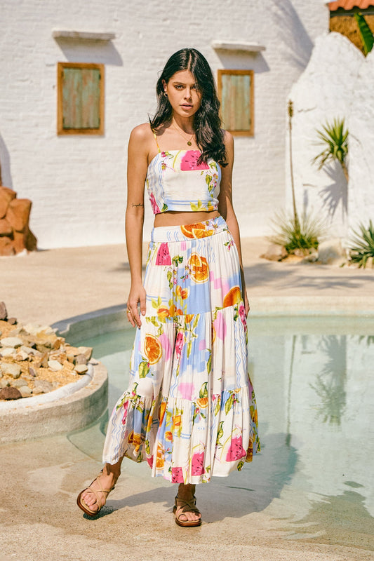 Image of a model wearing Pants. Productname: Heychic Tutti Tropical Tiered Maxi Skirt in Blue colour by brand - Heychic