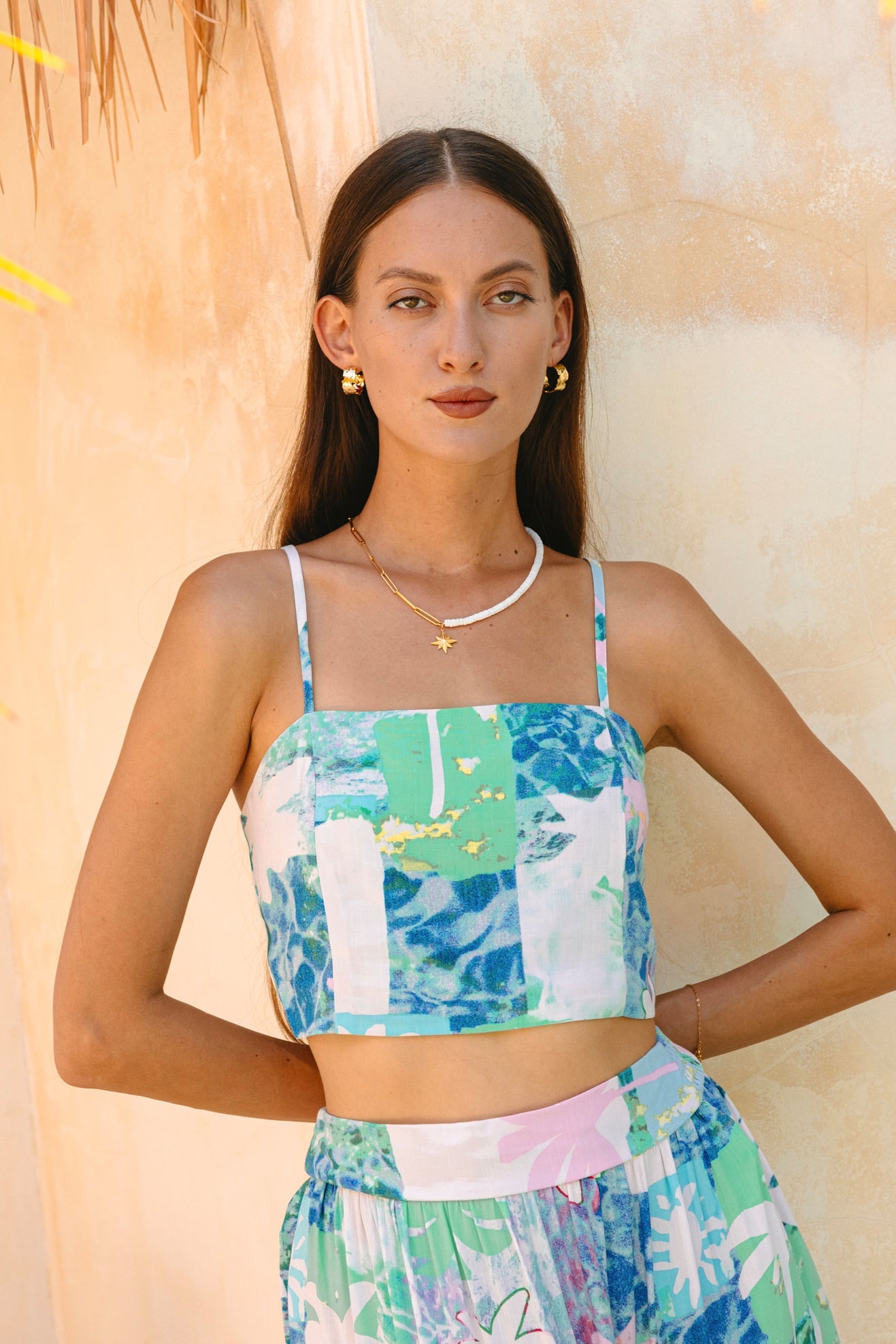 Image of a model wearing Tops. Productname: Heychic Maeve Aqua Blue Green Abstract Crop Top in Blue colour by brand - Heychic