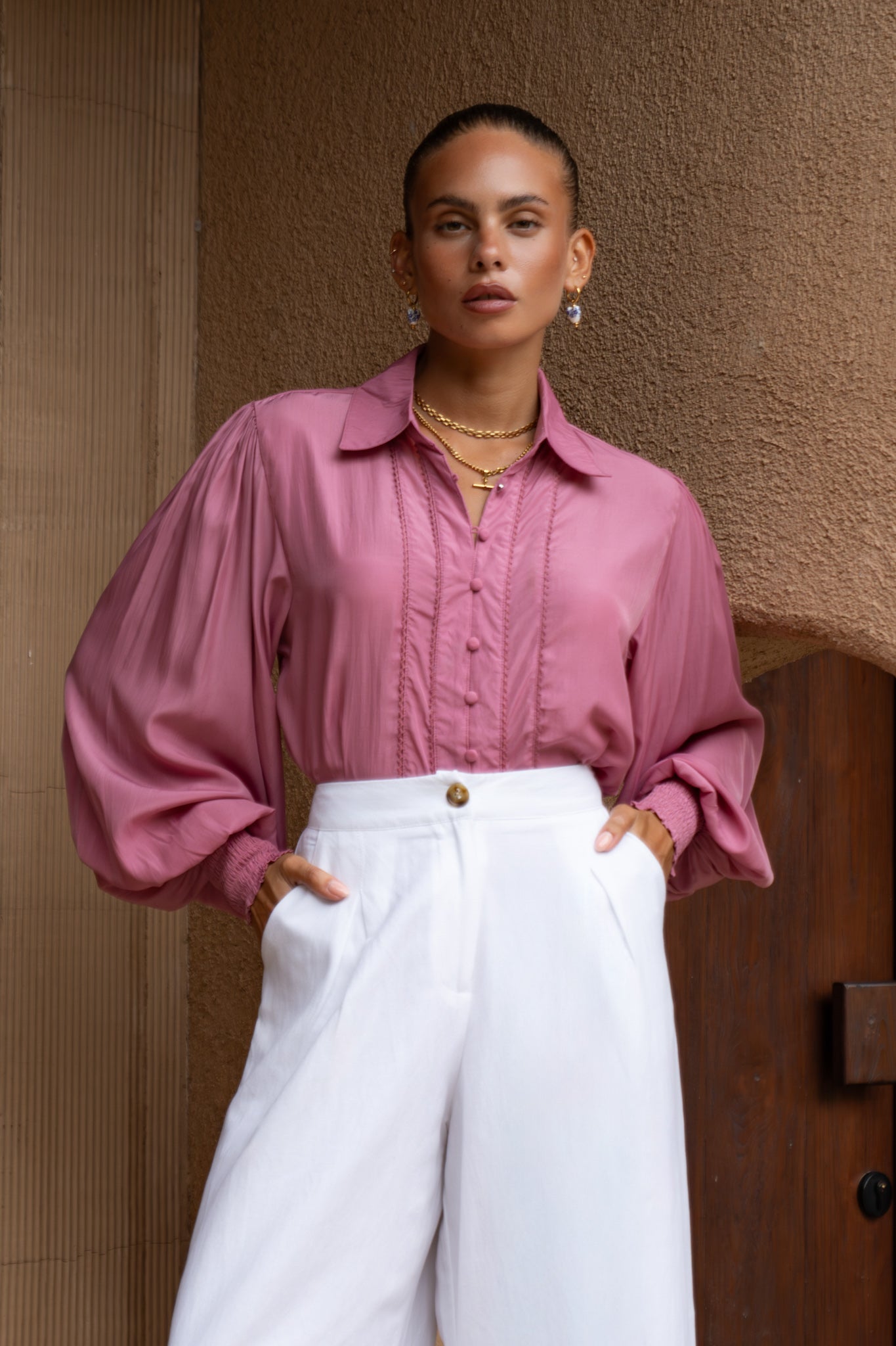 Image of a model wearing Tops. Productname: Heychic Rochelle Berry Pink Cupro Balloon Sleeve Blouse in Pink colour by brand - Heychic