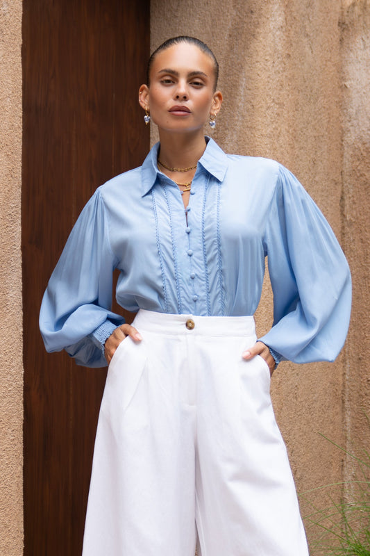 Image of a model wearing Tops. Productname: Heychic Rochelle Blue Cupro Balloon Sleeve Blouse in Blue colour by brand - Heychic