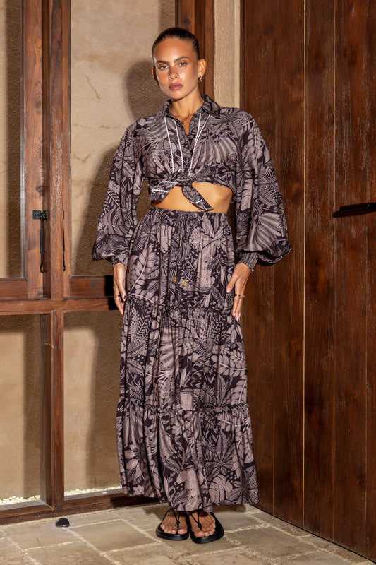 Image of a model wearing Pants. Productname: Heychic Dusk Mauve Tropical Maxi Skirt in Brown colour by brand - Heychic