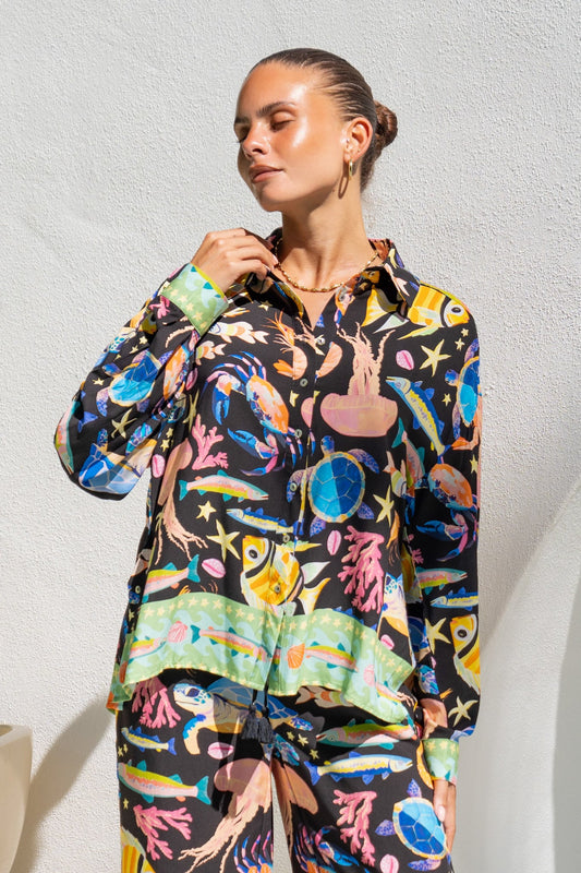 Image of a model wearing Tops. Product name - Delmare Multicolour Abstract Long Sleeve Shirt in Multi colour by brand - Heychic