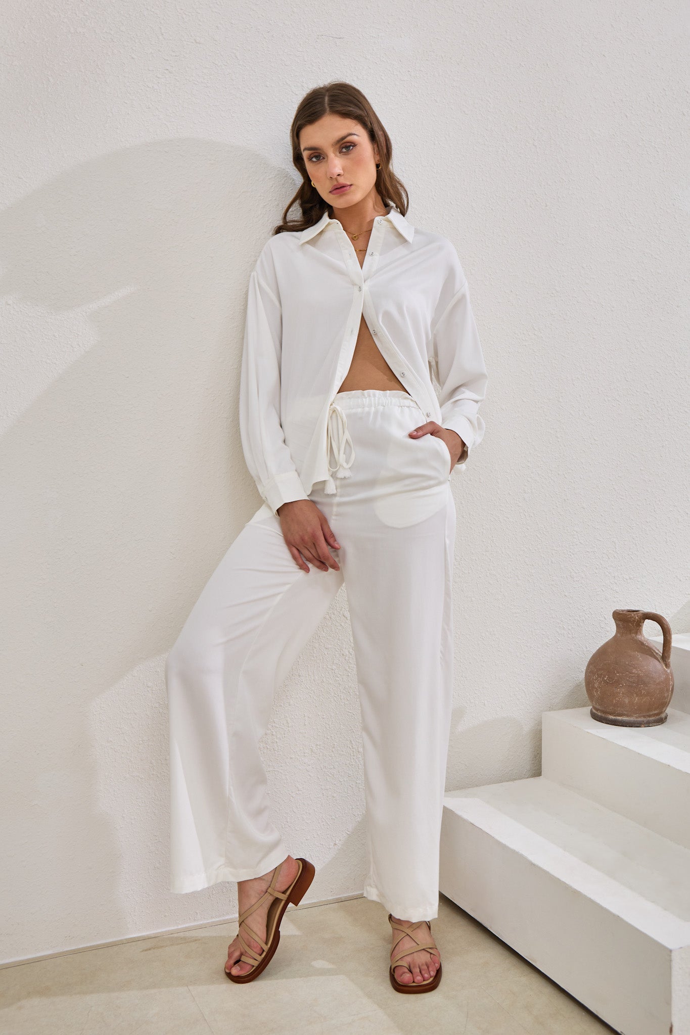 Image of a model wearing Pants. Productname: Heychic Page Cupro Pants in White colour by brand - Heychic