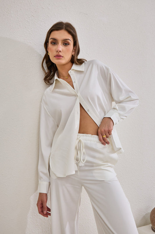 Image of a model wearing Tops. Productname: Heychic Page Cupro Shirt in White colour by brand - Heychic