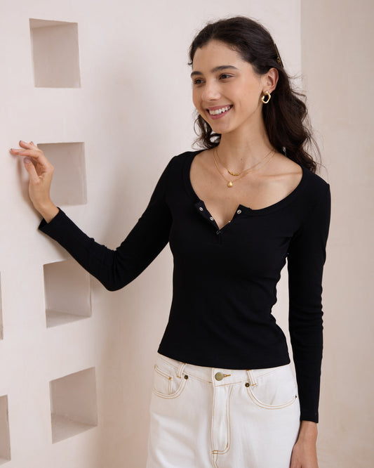 Image of a model wearing Tops. Productname: Heychic Ada Ribbed Long Sleeve Top in Black colour by brand - Heychic