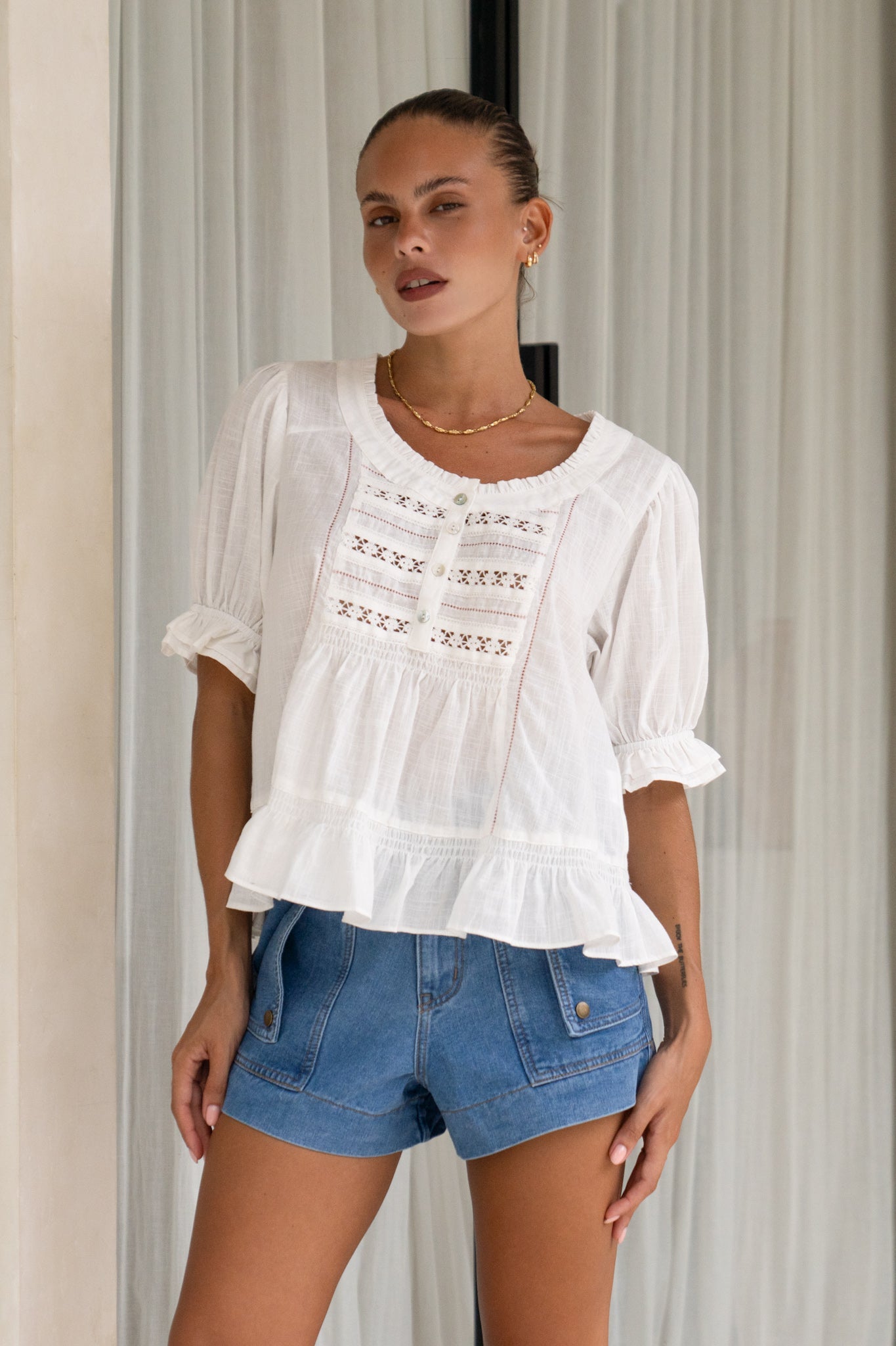 Image of a model wearing Tops. Productname: Heychic Leonie White Lace Detail Top in White colour by brand - Heychic