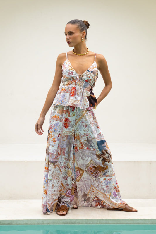 Image of a model wearing Shorts. Productname: Heychic Kasia Beige Lilac Abstract Wide Leg Pants in Beige colour by brand - Heychic