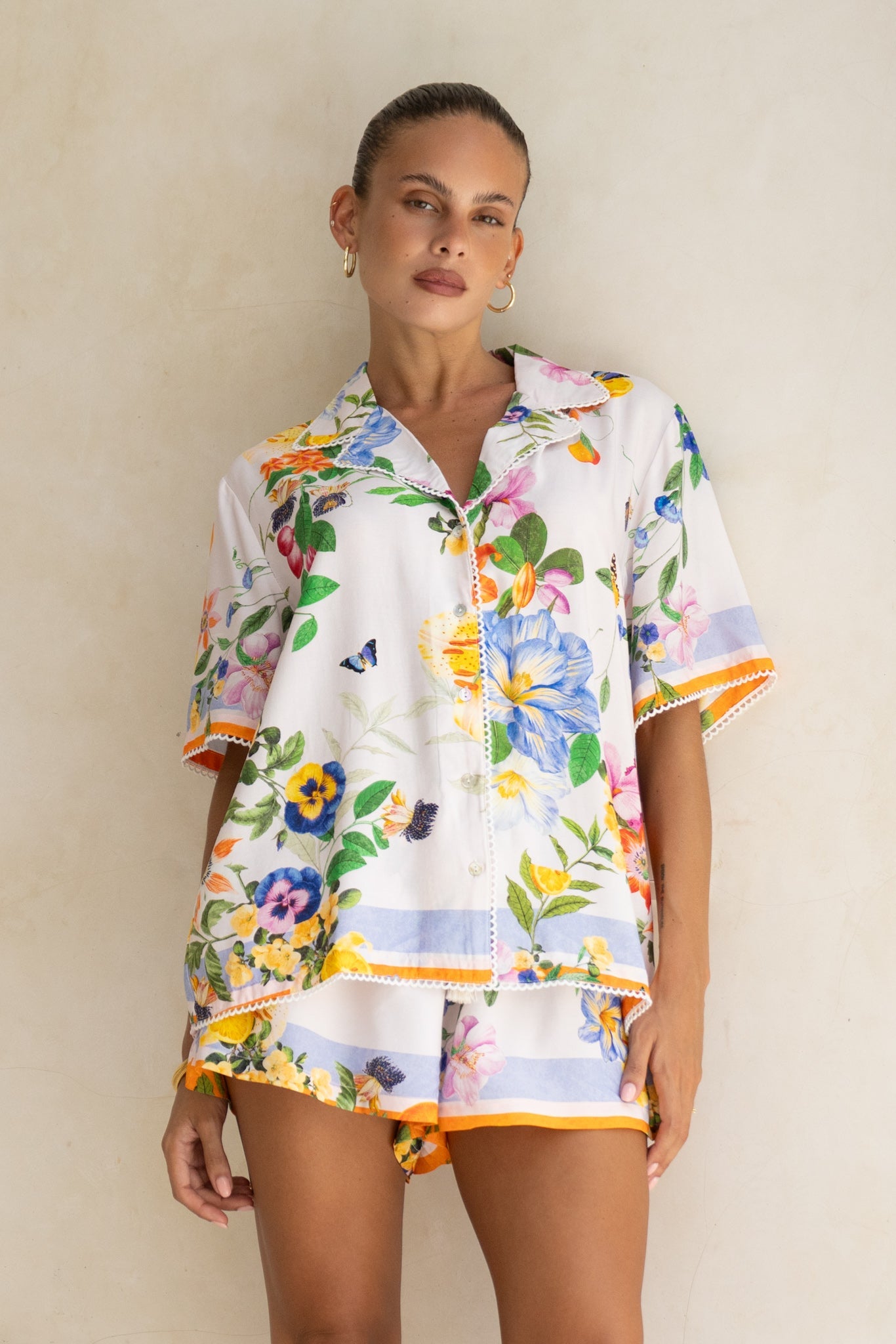 Image of a model wearing Tops. Product name - Felicity Orange Floral Scallop Lace Trim Shirt in Floral colour by brand - Heychic