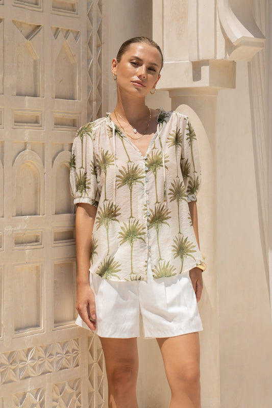 Image of a model wearing Tops. Productname: HEYCHIC Palm Green Tropical Puff Sleeve Blouse in Green colour by brand - HEYCHIC