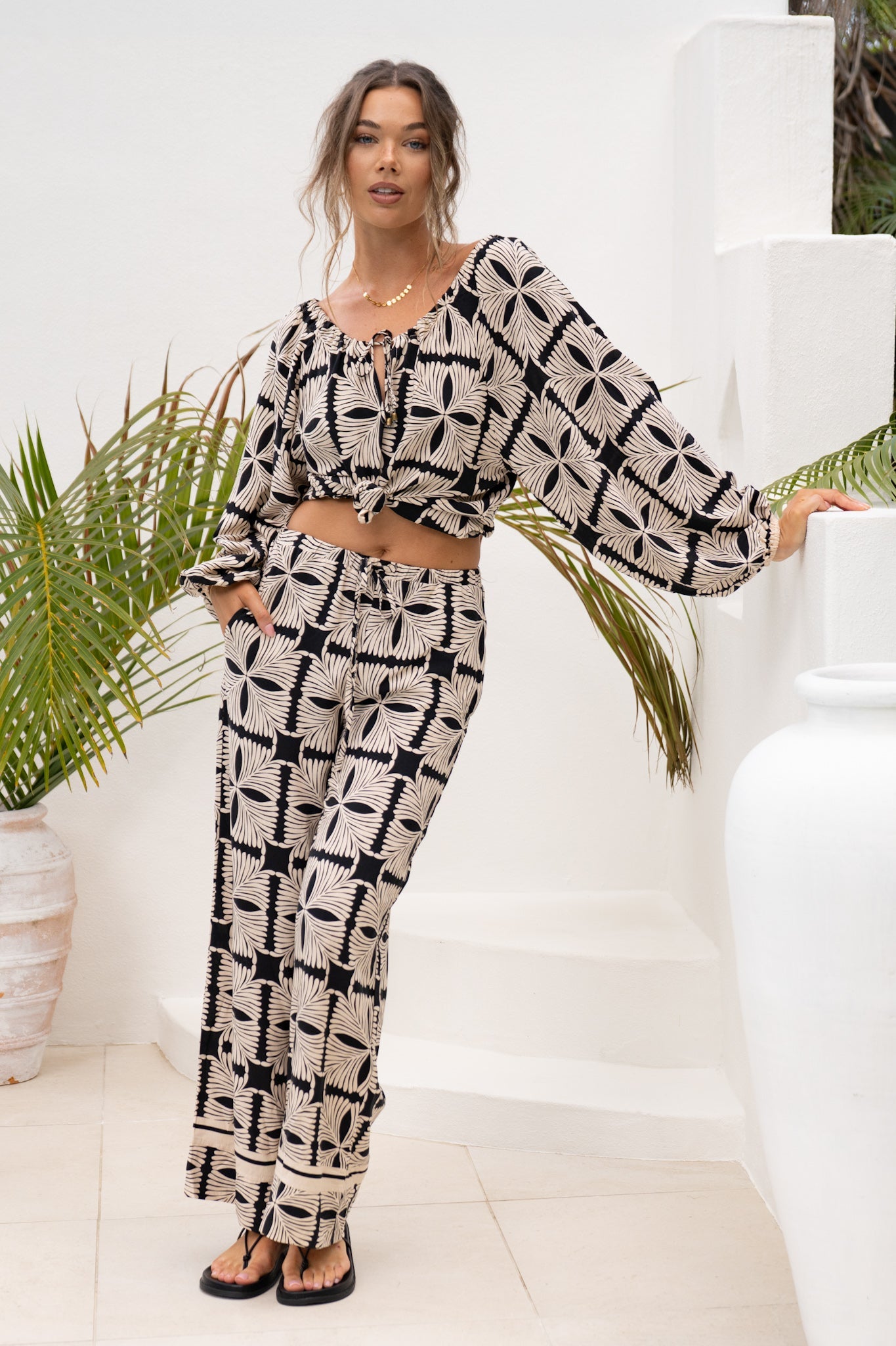 Image of a model wearing Shorts. Productname: Heychic Soraya Black Beige Abstract Pants in Beige colour by brand - Heychic