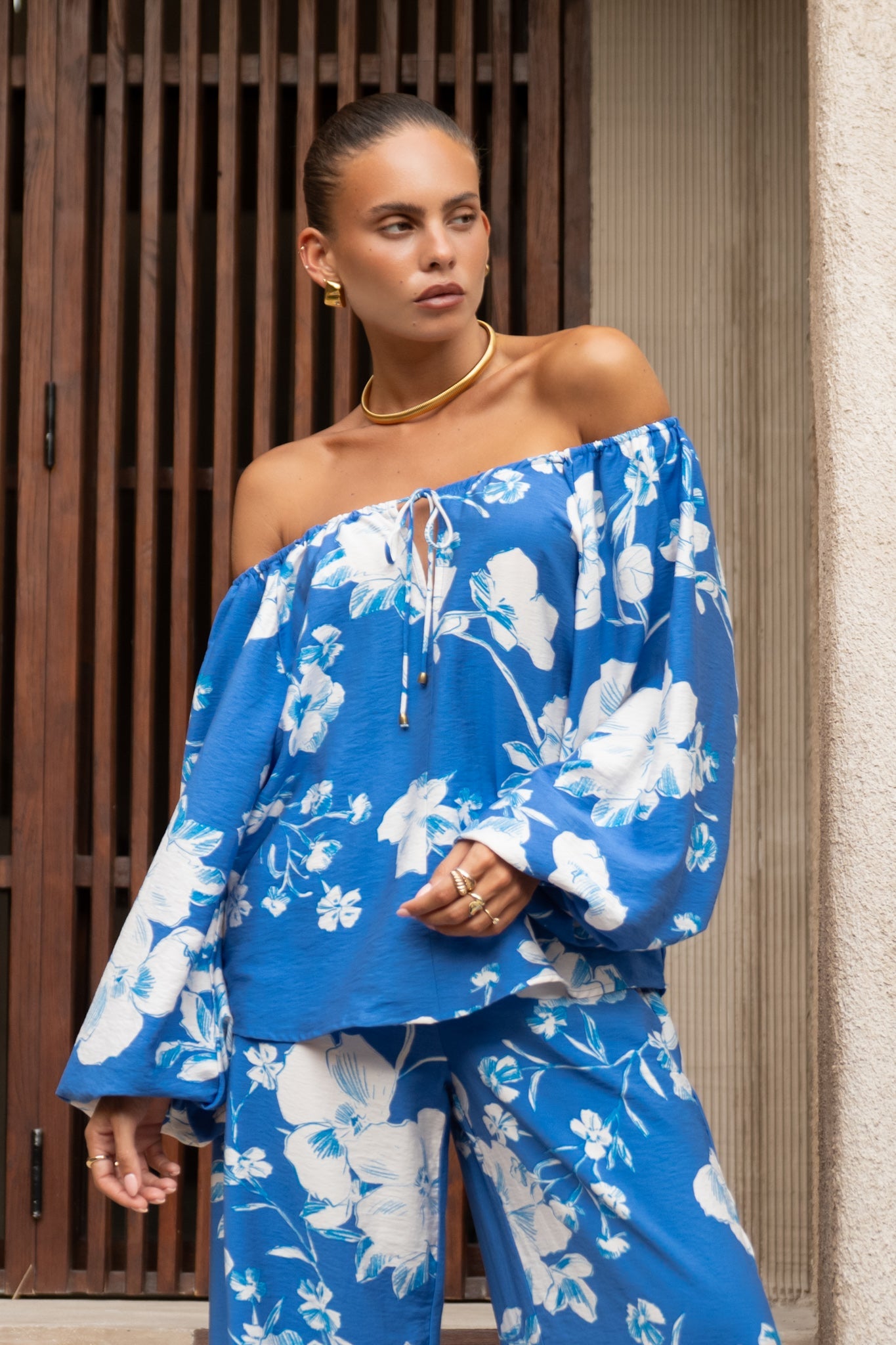 Image of a model wearing Tops. Productname: Heychic Lysandra Blue Floral Blouse in Blue colour by brand - Heychic