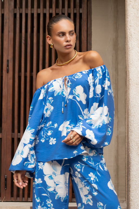 Image of a model wearing Tops. Productname: Heychic Lysandra Blue Floral Blouse in Blue colour by brand - Heychic