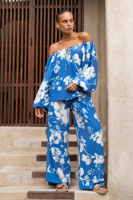 Image of a model wearing Pants. Productname: Heychic Lysandra Floral Pants in Blue colour by brand - Heychic