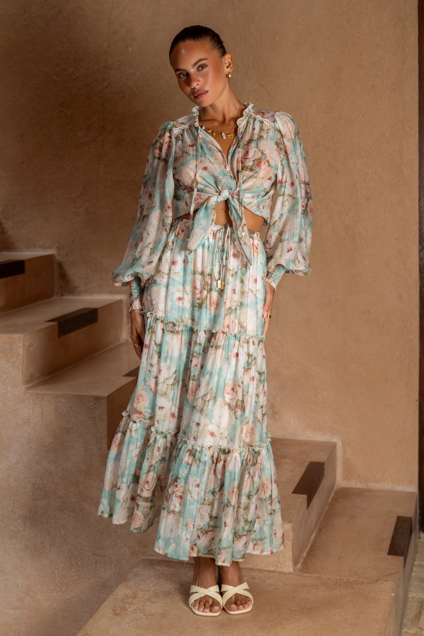 Image of a model wearing Skirts. Product name - Rosalind Teal Blue Pink Floral Maxi Skirt in Blue colour by brand - Heychic