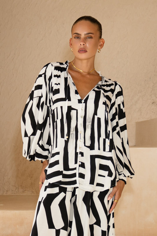 Image of a model wearing Tops. Productname: Heychic Kaede Geo Balloon Sleeve Blouse in Black colour by brand - Heychic