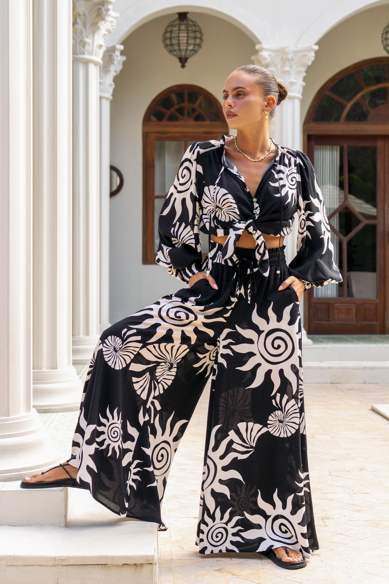 Image of a model wearing Shorts. Productname: Heychic Kai Black Abstract Wide Leg Pants in Black colour by brand - Heychic