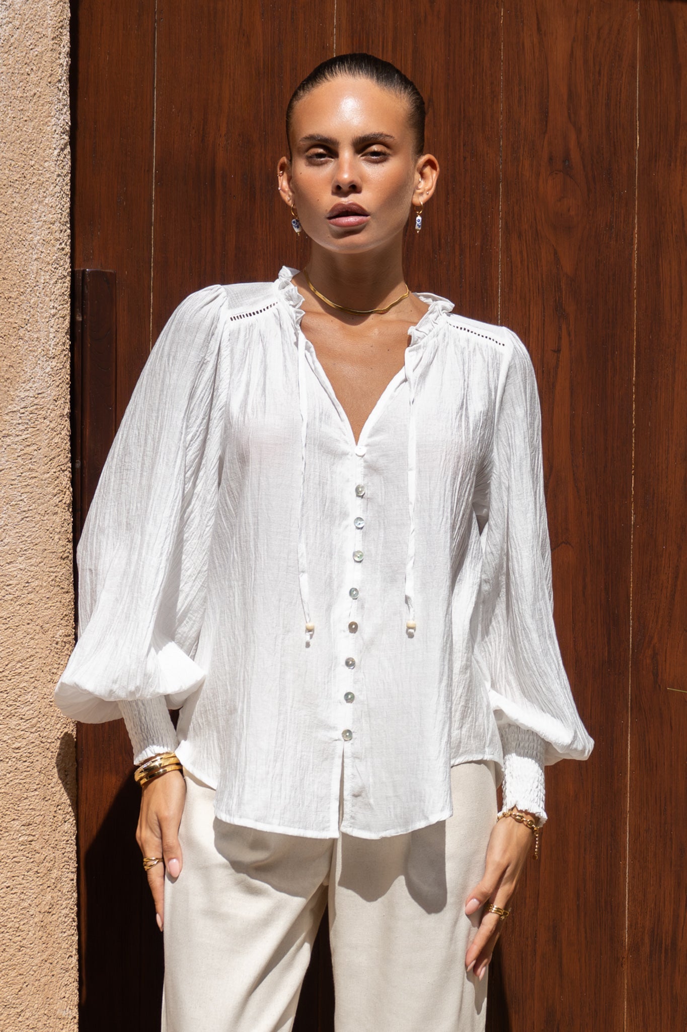 Image of a model wearing Tops. Productname: Heychic Freya White Balloon Sleeve Blouse in White colour by brand - Heychic