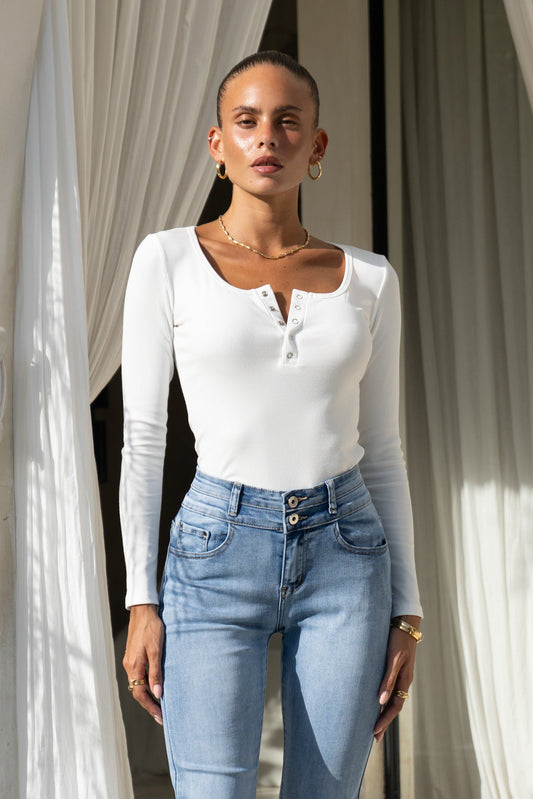 Image of a model wearing Tops. Productname: Ida Off-White Long Sleeve Top in White colour by brand - Heychic