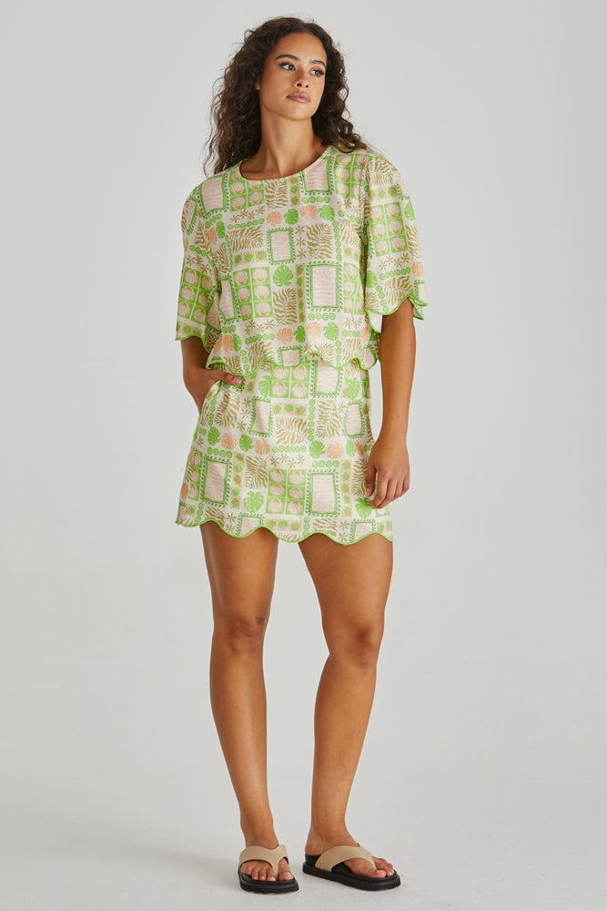 Image of a model wearing Skirts. Product name - Emmett Scallop Skirt Green Shell Patchwork in Green Shell Patchwork colour by brand - Sass Clothing