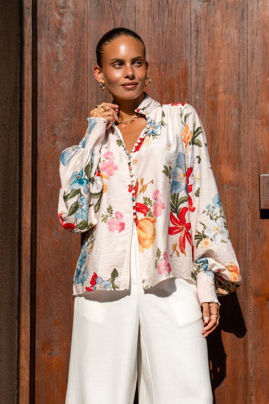 Image of a model wearing Tops. Product name - Joyce Multicolour Floral Balloon Sleeve Blouse in Floral colour by brand - Heychic