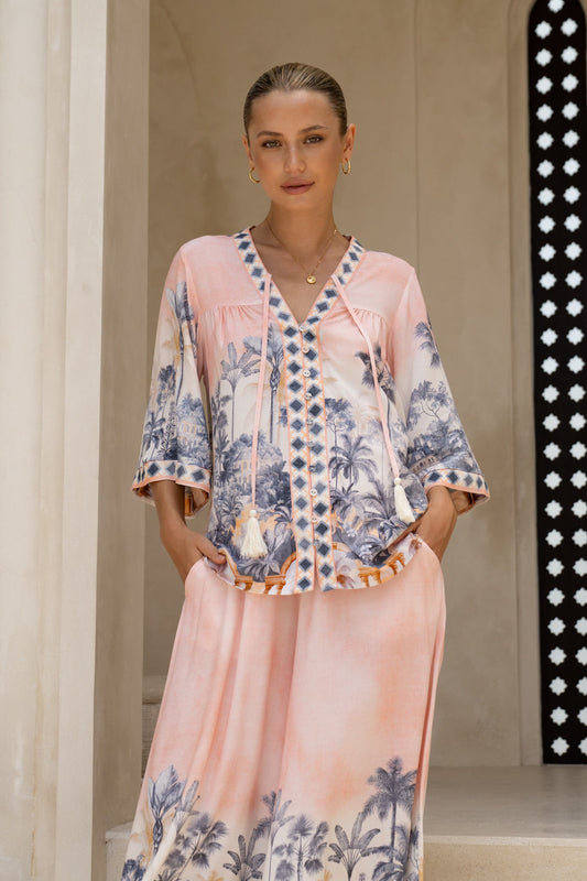 Image of a model wearing Tops. Productname: HEYCHIC Marzella Pink Tropical Shirt in Pink colour by brand - HEYCHIC