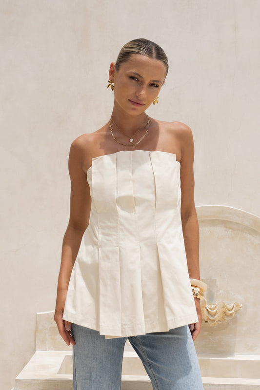 Image of a model wearing Tops. Productname: HEYCHIC Avie Beige Pleated Strapless Top in Beige colour by brand - HEYCHIC