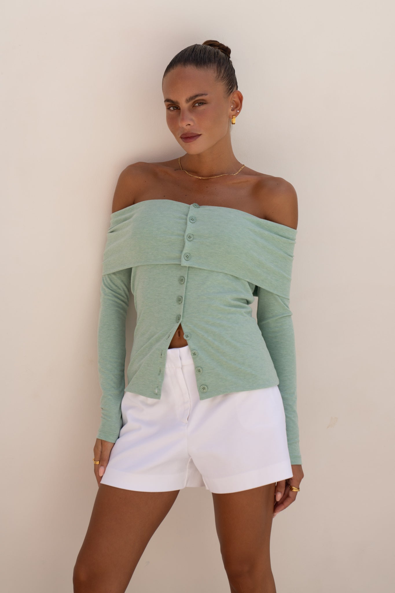 Image of a model wearing Tops. Productname: Heychic Arima Off Shoulder Long Sleeve Top in Green colour by brand - Heychic