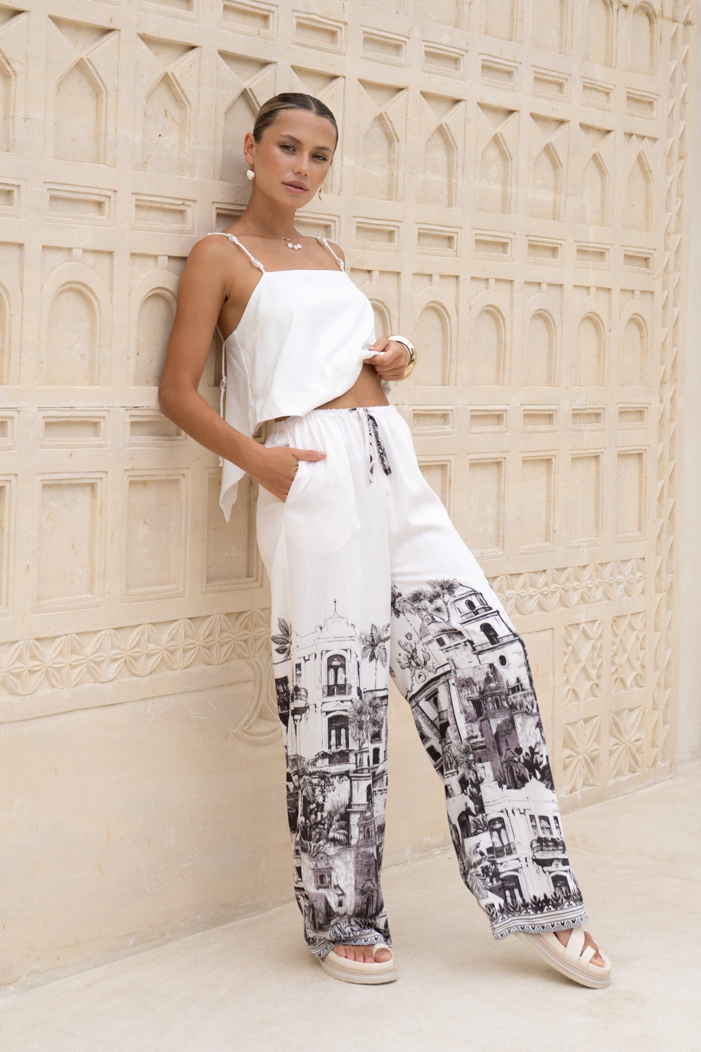 Image of a model wearing Shorts. Productname: HEYCHIC Cira Black Abstract Pants in Black colour by brand - HEYCHIC